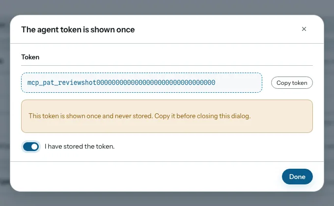 Dialog titled the agent token is shown once, with the token, a copy button, and a confirmation toggle